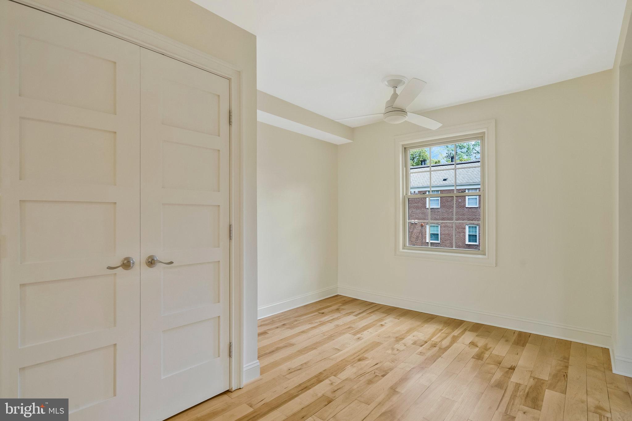 2505 Arlington Boulevard, Unit 102 Arlington, VA 22201 - Photo 12 of 26 an empty room with windows and closet