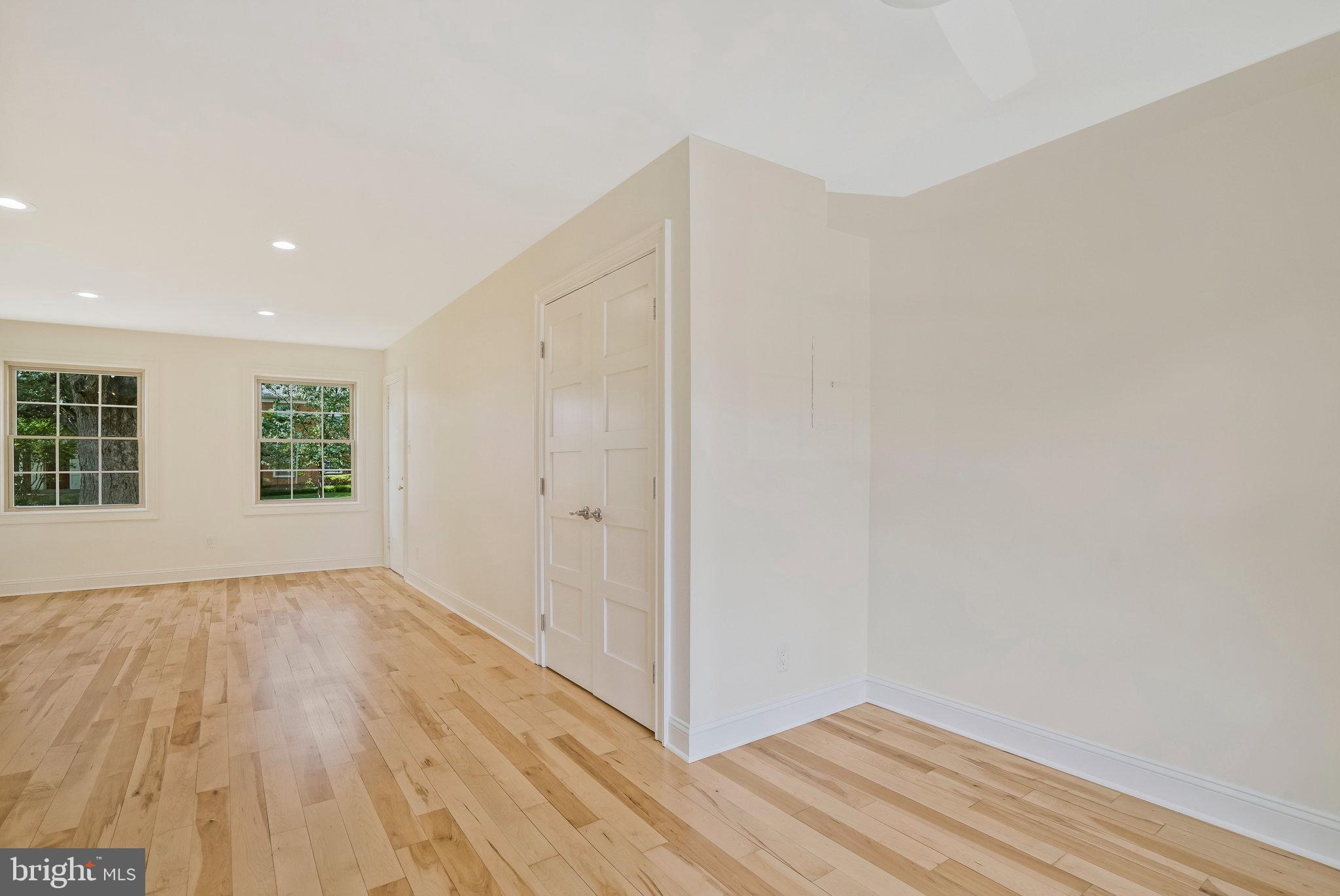 2505 Arlington Boulevard, Unit 102 Arlington, VA 22201 - Photo 15 of 26 a view of an empty room with wooden floor and a window