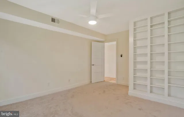 a view of an empty room with a empty shelves