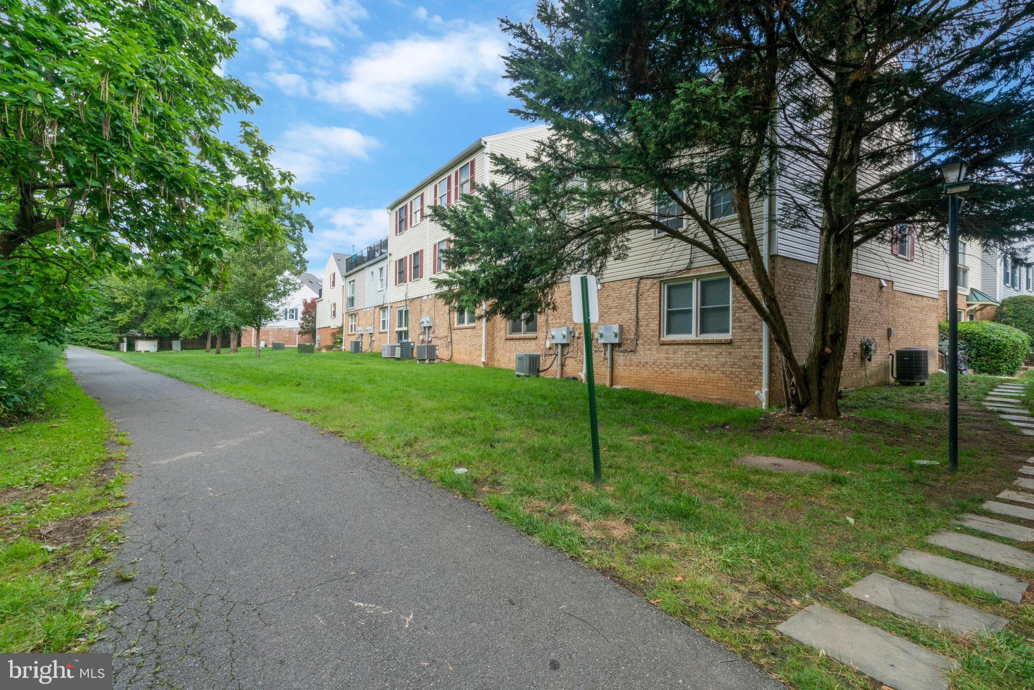 2505 Arlington Boulevard, Unit 102 Arlington, VA 22201 - Photo 22 of 26 a front view of house with yard and green space