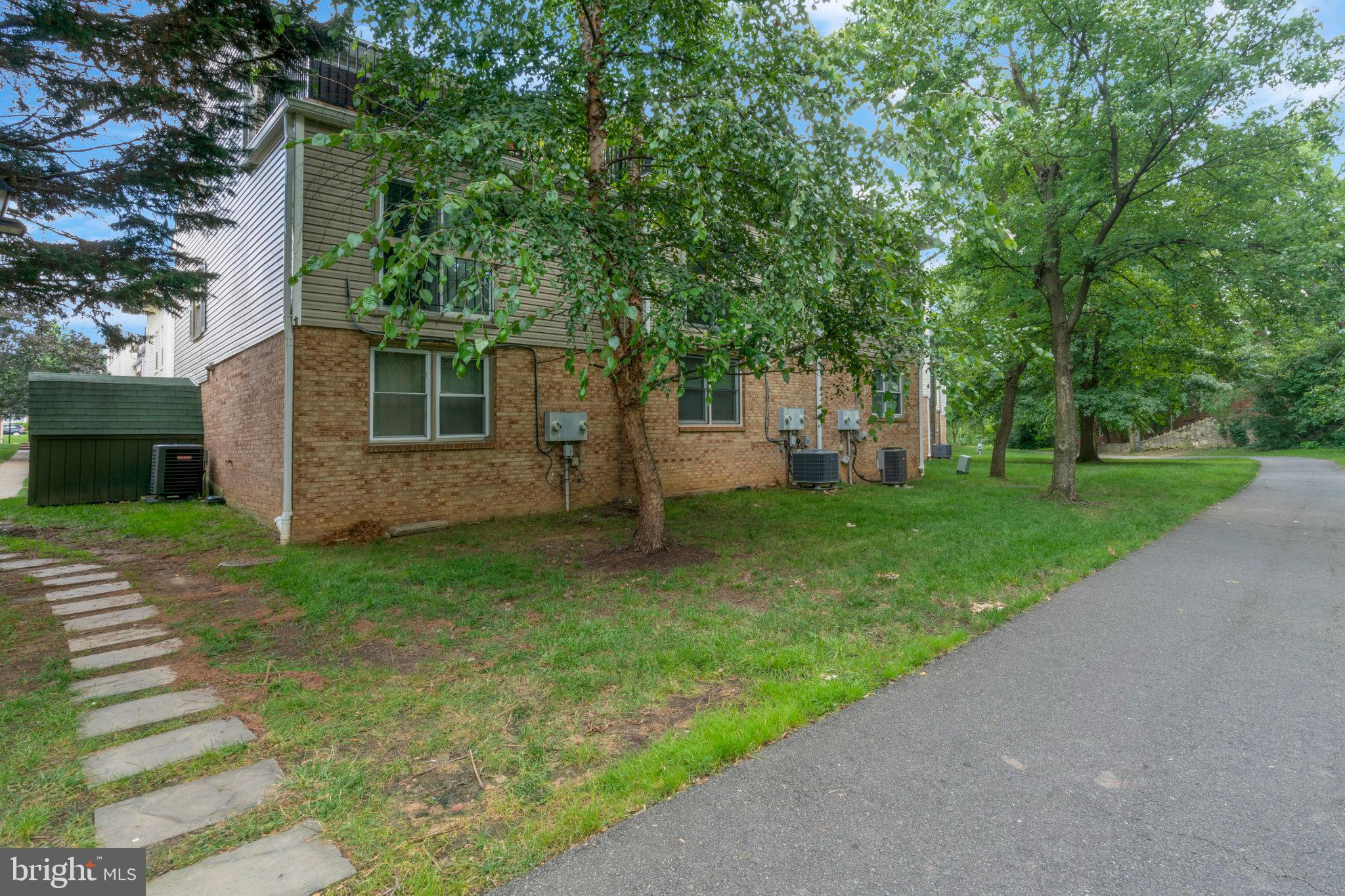 2505 Arlington Boulevard, Unit 102 Arlington, VA 22201 - Photo 23 of 26 a view of a house with yard and a garden