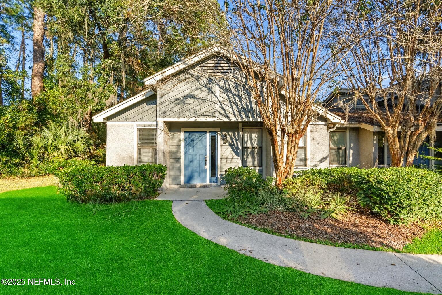 front view of a house with a yard
