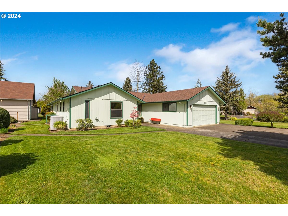 9666 South Gribble Road Canby, OR 97013 - Photo 3 of 48 a front view of a house with a yard