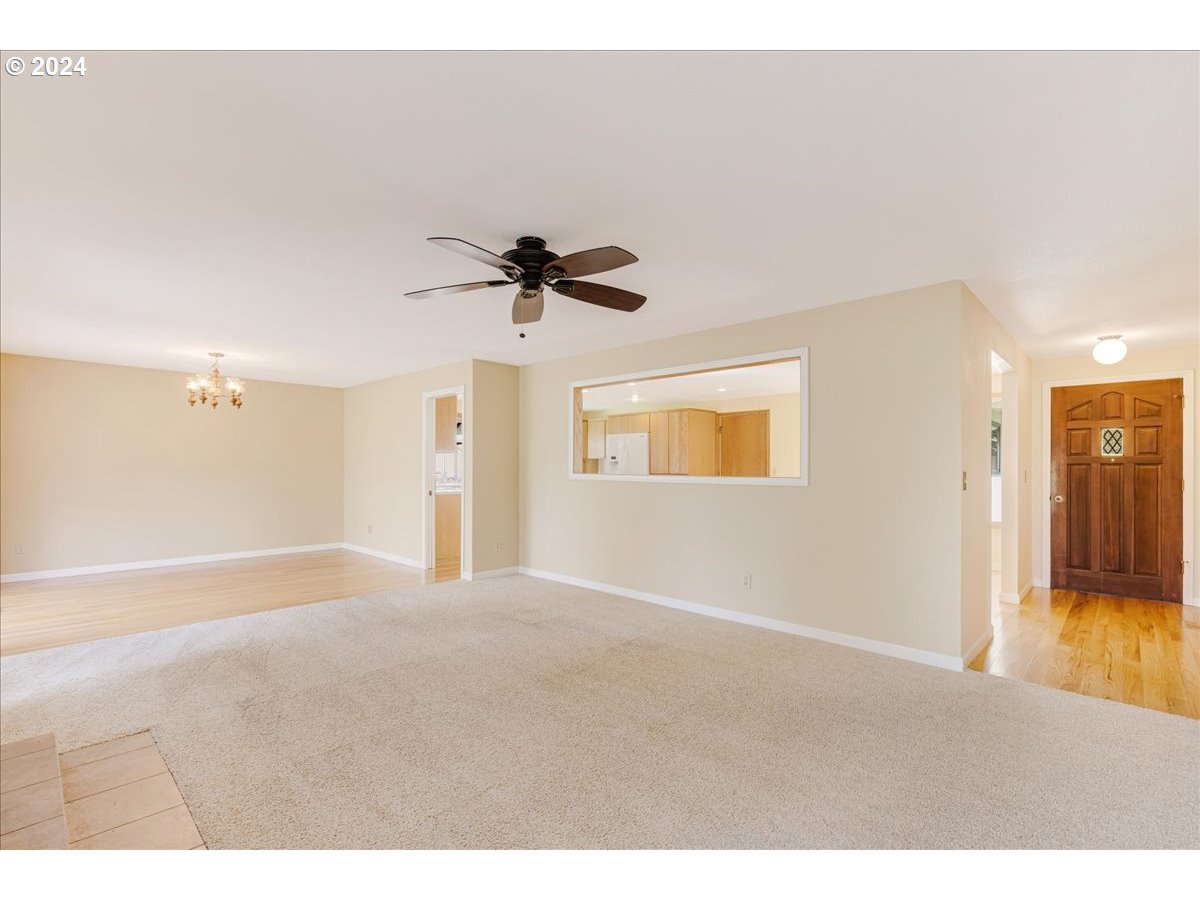 9666 South Gribble Road Canby, OR 97013 - Photo 9 of 48 a view of a livingroom with a ceiling fan