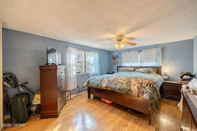 a view of house with a yard