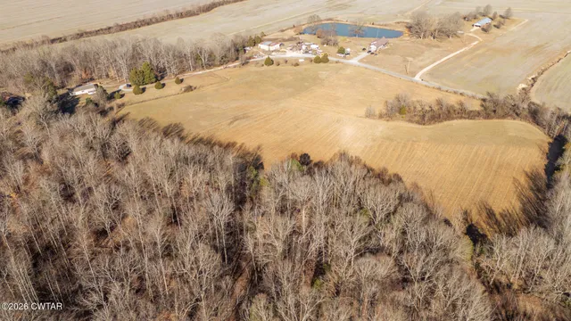a living room with furniture a couch and a flat screen tv