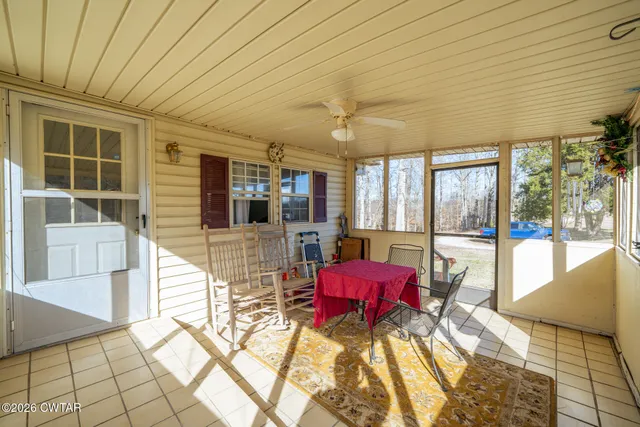 a kitchen that has a lot of cabinets a sink and appliances in it