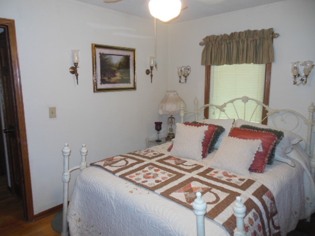 3918 Abbotsford Road Rockford, IL 61107 - Photo 14 of 25 a bedroom with a bed and a painting on the wall