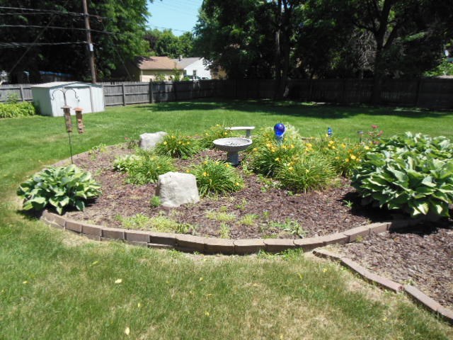 3918 Abbotsford Road Rockford, IL 61107 - Photo 24 of 25 a view of a garden with a fountain