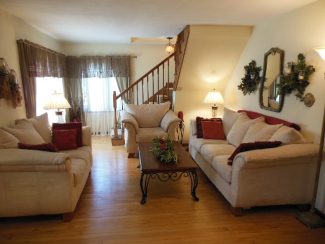 3918 Abbotsford Road Rockford, IL 61107 - Photo 4 of 25 a living room with furniture and a wooden floor