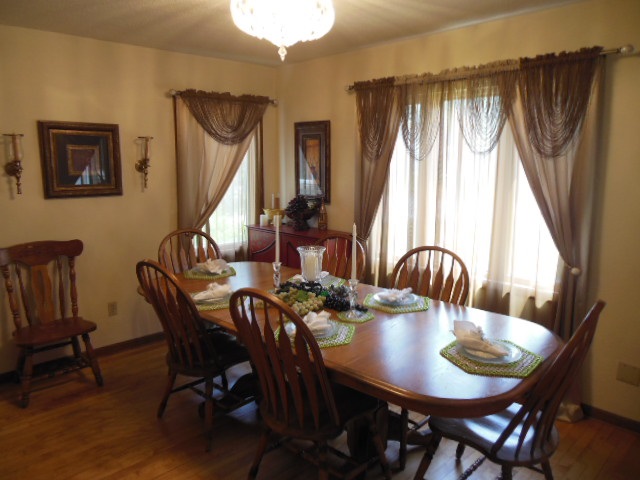 3918 Abbotsford Road Rockford, IL 61107 - Photo 7 of 25 a view of a dining room with furniture window and wooden floor