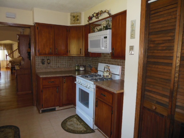 3918 Abbotsford Road Rockford, IL 61107 - Photo 8 of 25 a kitchen with stainless steel appliances granite countertop a stove and a refrigerator