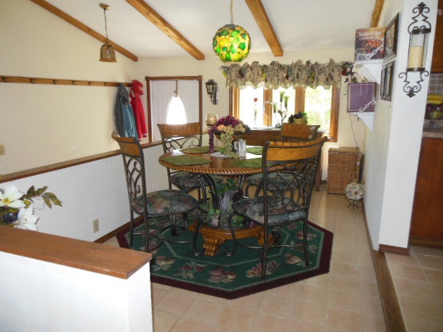 3918 Abbotsford Road Rockford, IL 61107 - Photo 10 of 25 a view of a dining room with furniture and a chandelier