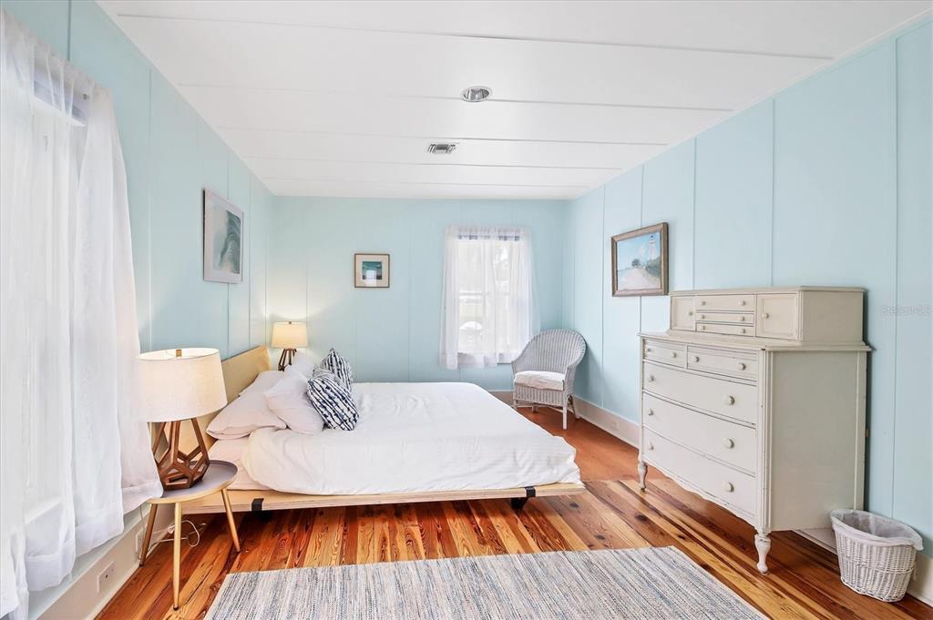 241 Gilchrist Avenue, Unit C Boca Grande, FL 33921 - Photo 14 of 23 a view of a dining room with furniture and wooden floor