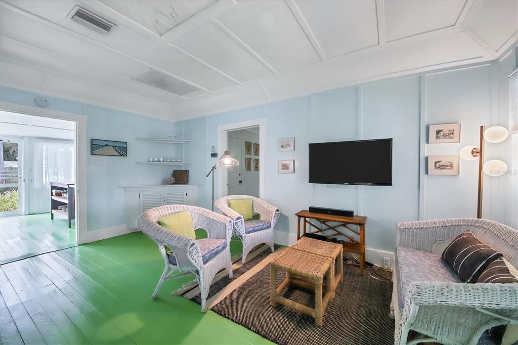 241 Gilchrist Avenue, Unit C Boca Grande, FL 33921 - Photo 17 of 23 a living room with furniture and a flat screen tv