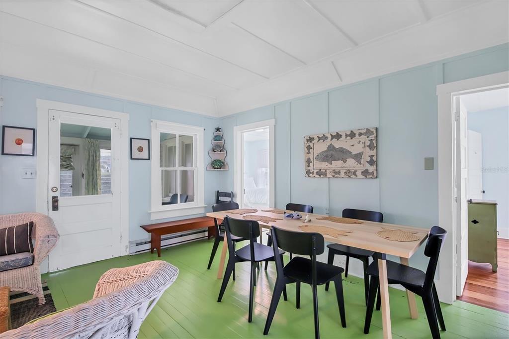 241 Gilchrist Avenue, Unit C Boca Grande, FL 33921 - Photo 18 of 23 a view of a dining room with furniture