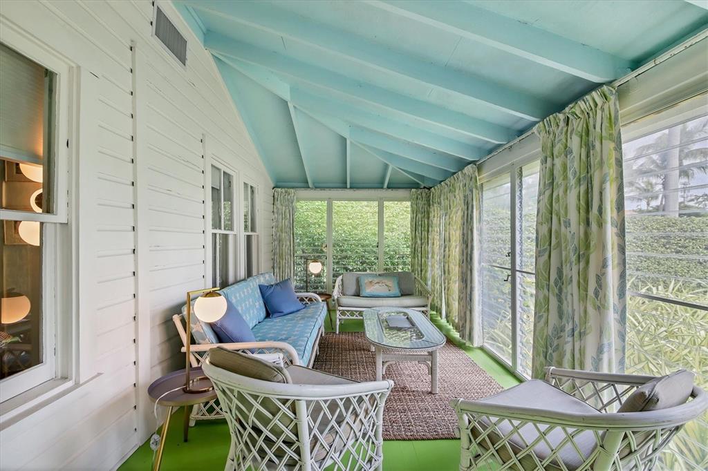 241 Gilchrist Avenue, Unit C Boca Grande, FL 33921 - Photo 8 of 23 a outdoor living space with furniture and garden view