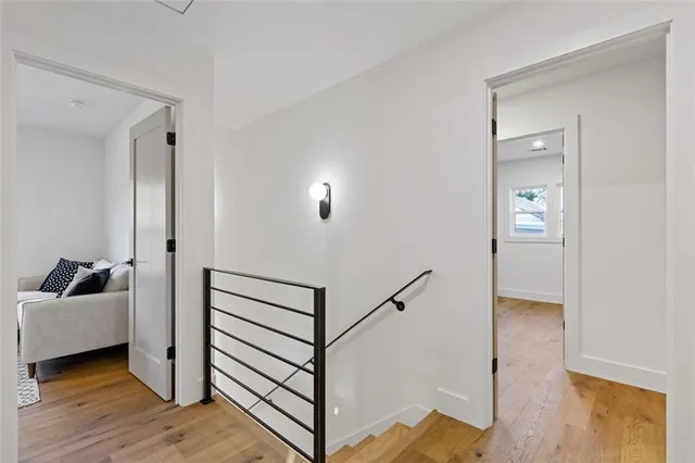 a view of a livingroom with furniture and stairs