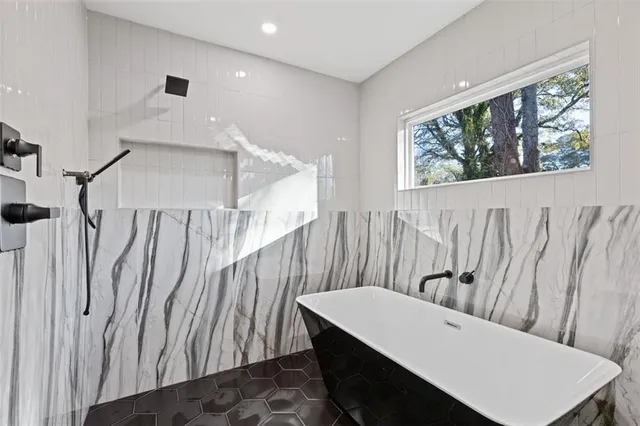 a view of a hallway with seating area