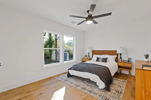 a bedroom with a bed and window