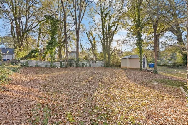 a view of a yard with some trees