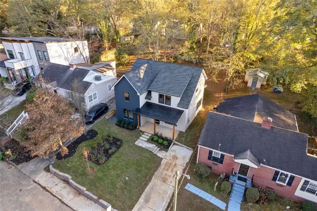an aerial view of house with yard