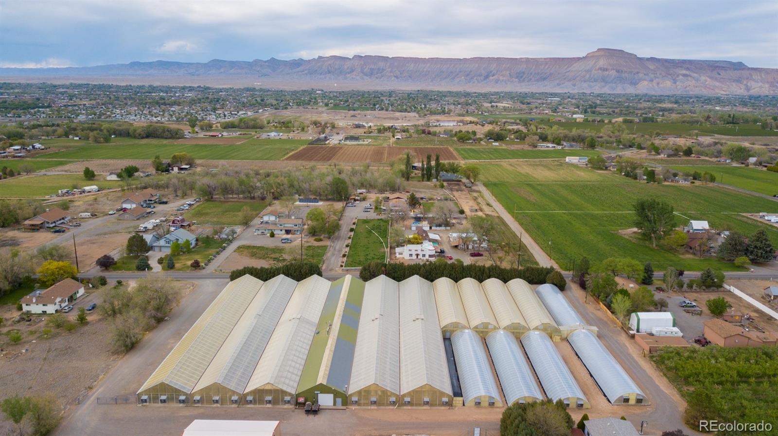 3281 C Road Palisade, CO 81526 - Photo 1 of 33 an aerial view of residential houses with outdoor space