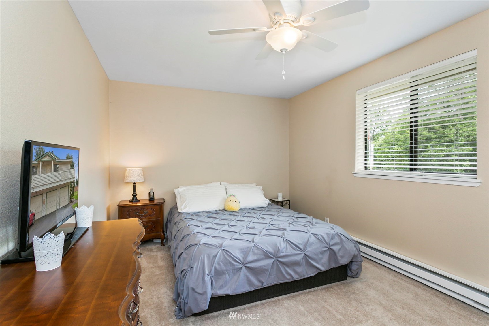 1806 201st Place Southeast, Unit 1D Bothell, WA 98012 - Photo 12 of 20 a bedroom with a bed and a flat screen tv