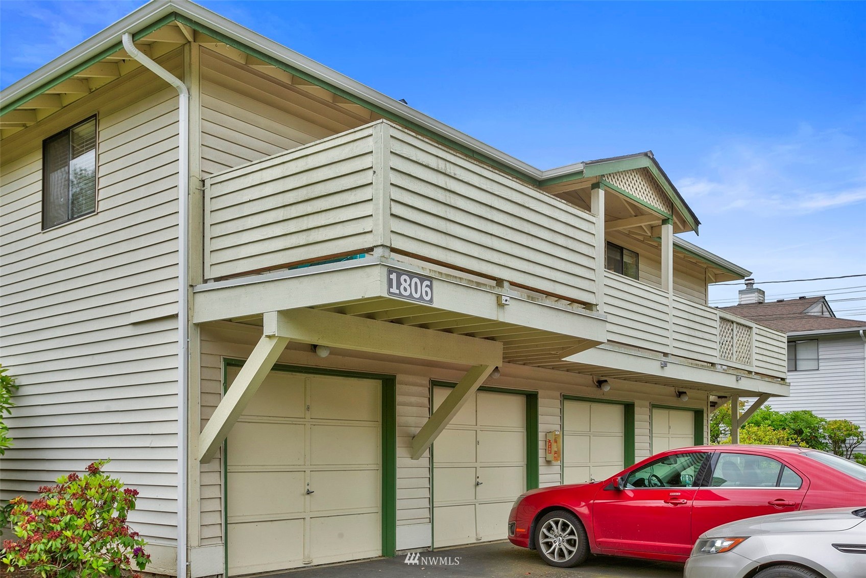 1806 201st Place Southeast, Unit 1D Bothell, WA 98012 - Photo 3 of 20 a front view of a house with parking space