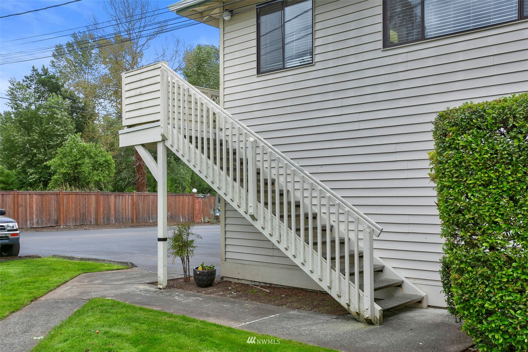 1806 201st Place Southeast, Unit 1D Bothell, WA 98012 - Photo 4 of 20 a view of a deck with a white fence