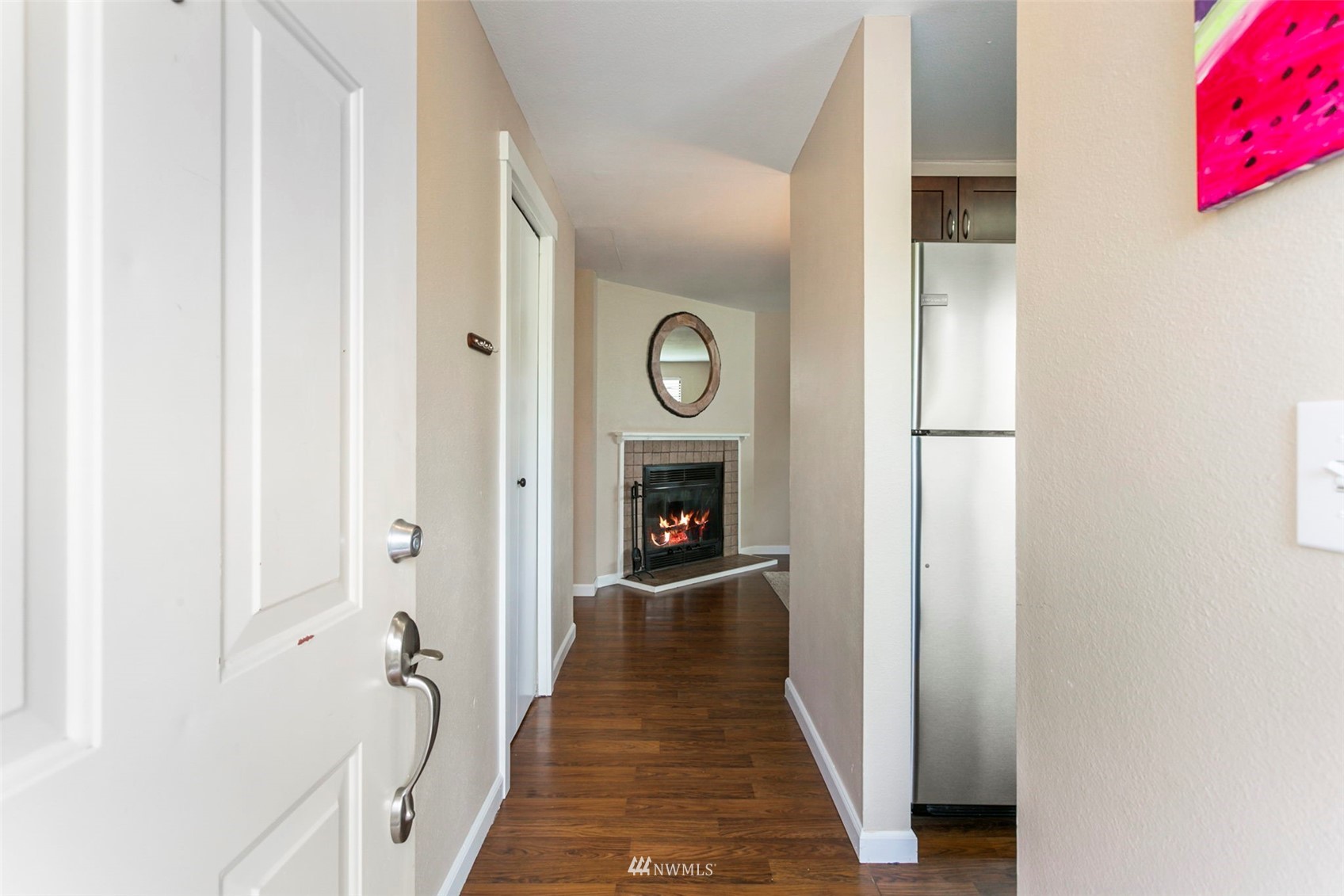 1806 201st Place Southeast, Unit 1D Bothell, WA 98012 - Photo 5 of 20 a view of a hallway with wooden floor and staircase