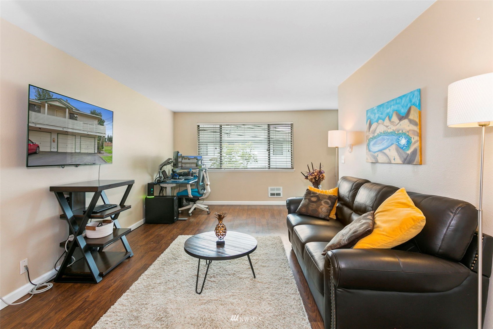 1806 201st Place Southeast, Unit 1D Bothell, WA 98012 - Photo 6 of 20 a living room with furniture and a wooden floor