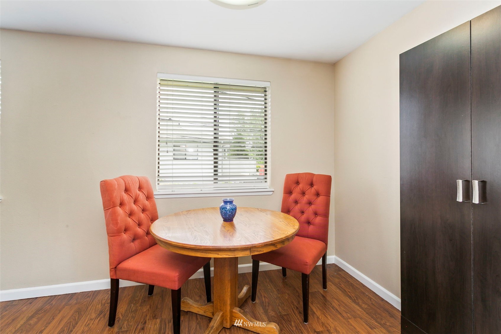 1806 201st Place Southeast, Unit 1D Bothell, WA 98012 - Photo 9 of 20 a dining room with furniture and wooden floor
