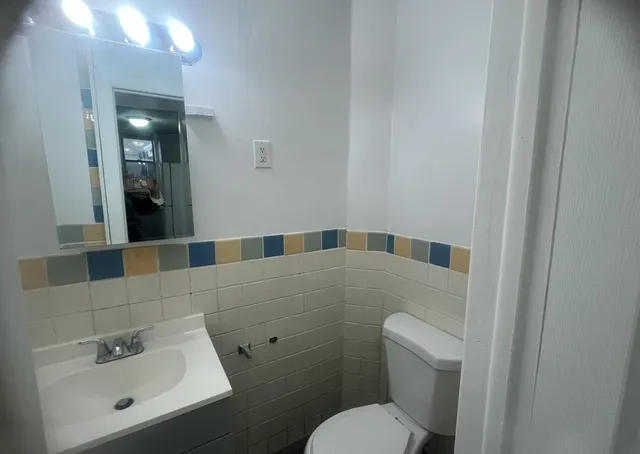 a white refrigerator freezer sitting inside of a kitchen