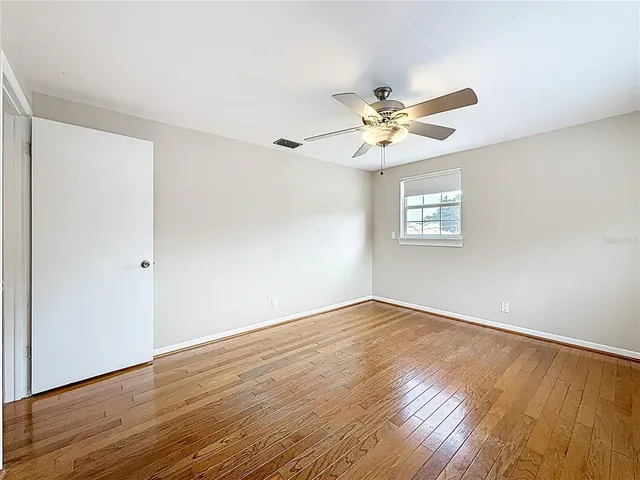 a kitchen with stainless steel appliances granite countertop a sink a stove a counter space and cabinets