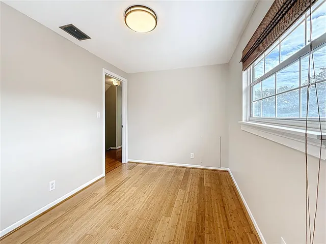 a view of a house with backyard and porch