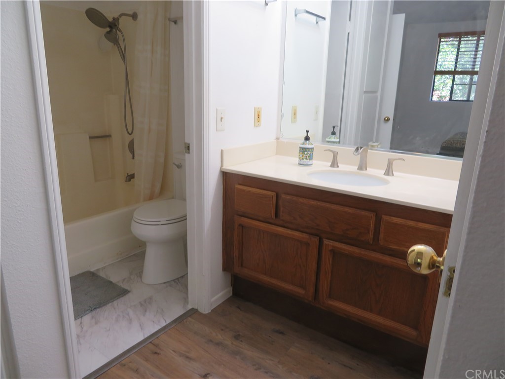 8167 Vineyard Avenue, Unit 66 Rancho Cucamonga, CA 91730 - Photo 14 of 16 a bathroom with a sink a toilet and shower