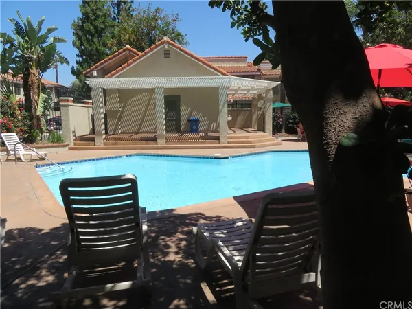 a view of a outdoor space with swimming pool