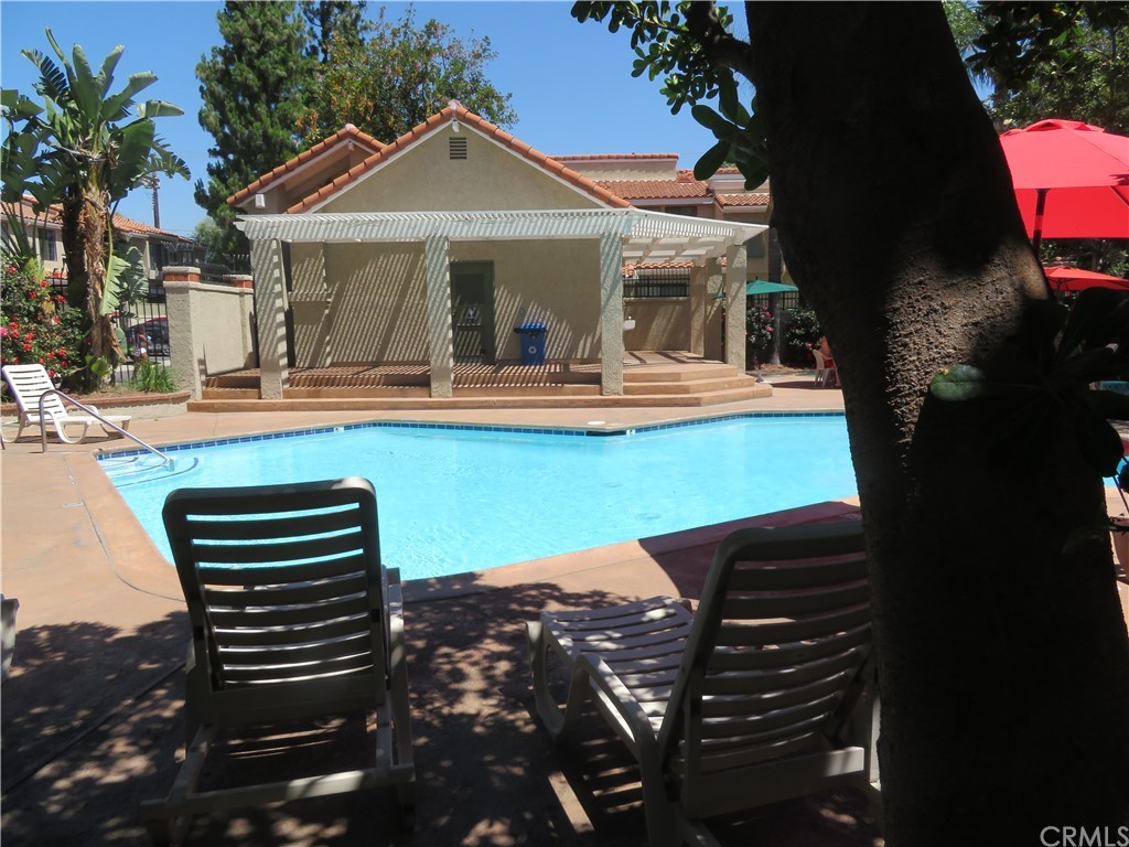 8167 Vineyard Avenue, Unit 66 Rancho Cucamonga, CA 91730 - Photo 3 of 16 a view of a outdoor space with swimming pool