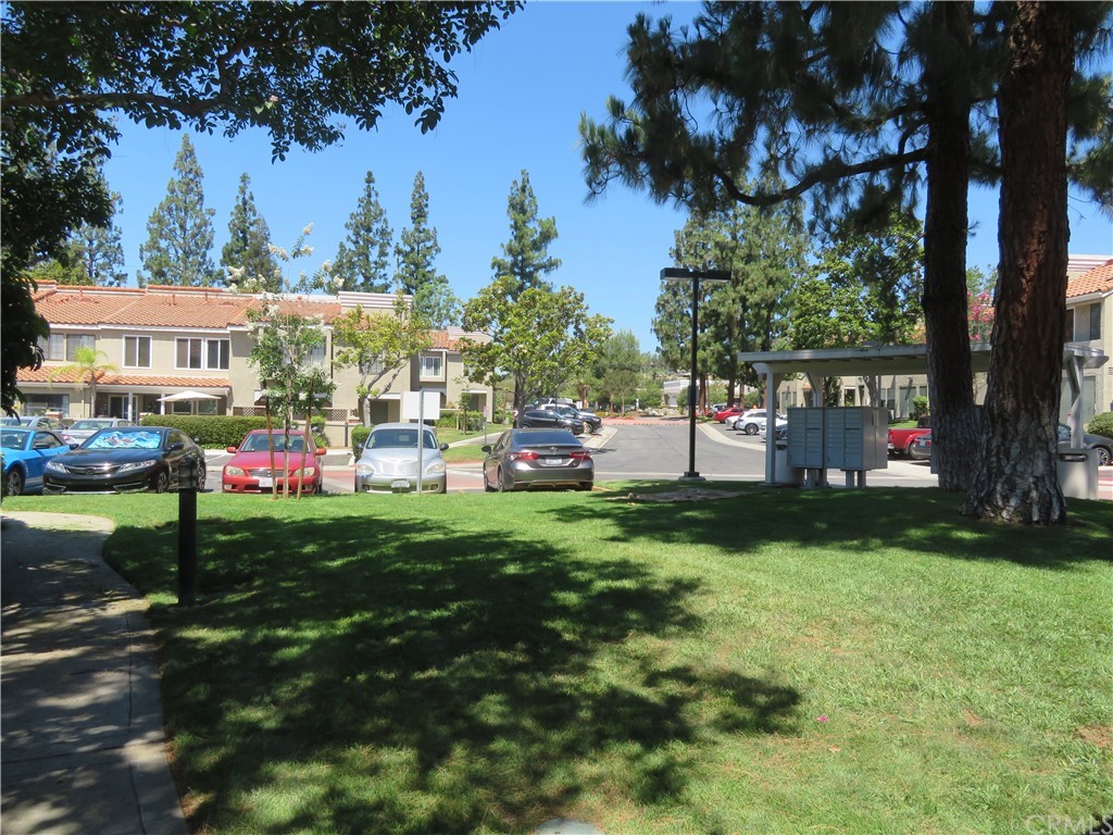 8167 Vineyard Avenue, Unit 66 Rancho Cucamonga, CA 91730 - Photo 5 of 16 a view of yard with swimming pool and green space