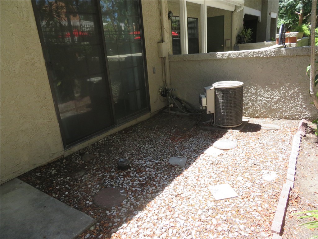 8167 Vineyard Avenue, Unit 66 Rancho Cucamonga, CA 91730 - Photo 6 of 16 a view of a balcony with door