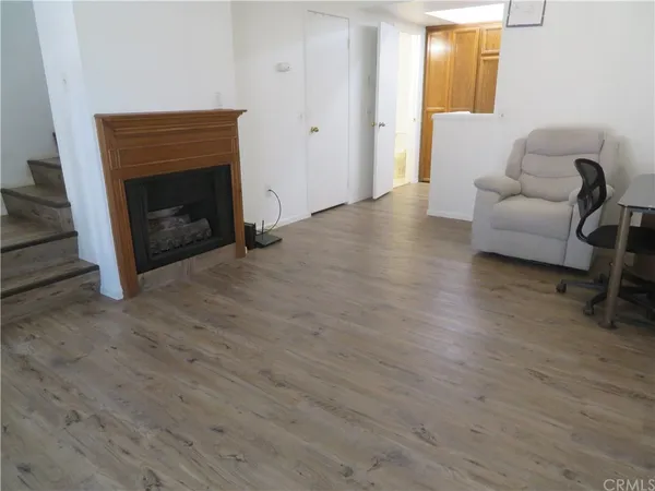 a view of livingroom with furniture and a fireplace