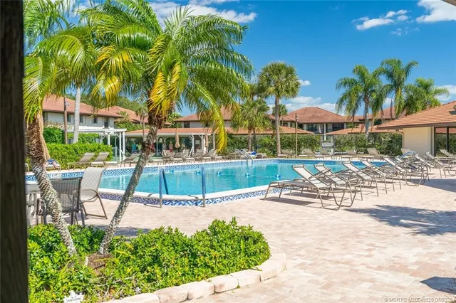a view of a swimming pool with a patio