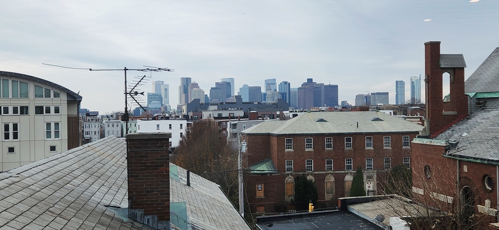 58 Lubec Street, Unit 8 Boston, MA 02128 - Photo 15 of 16 a view of a terrace with city view