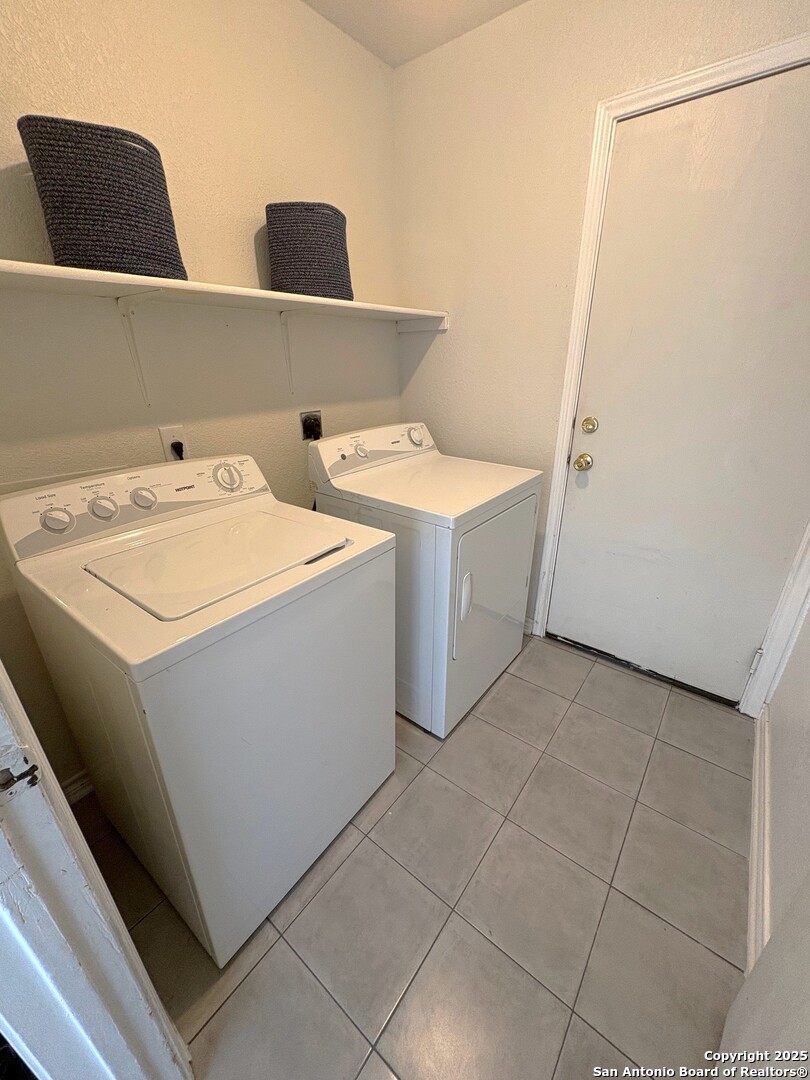 10134 Ranger Canyon San Antonio, TX 78251 - Photo 12 of 22 a utility room with dryer and washer