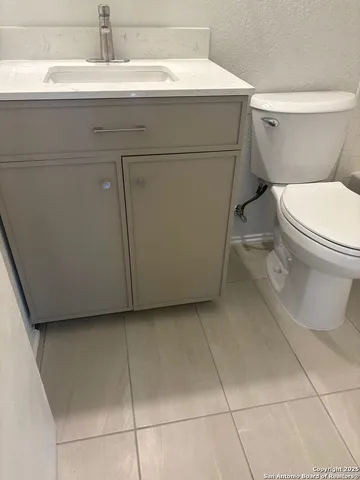 a bathroom with a toilet and a sink