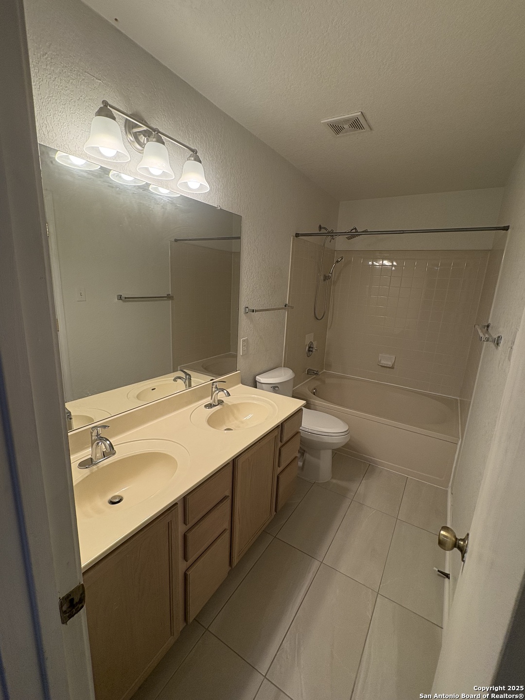 10134 Ranger Canyon San Antonio, TX 78251 - Photo 17 of 22 a bathroom with a sink mirror and toilet
