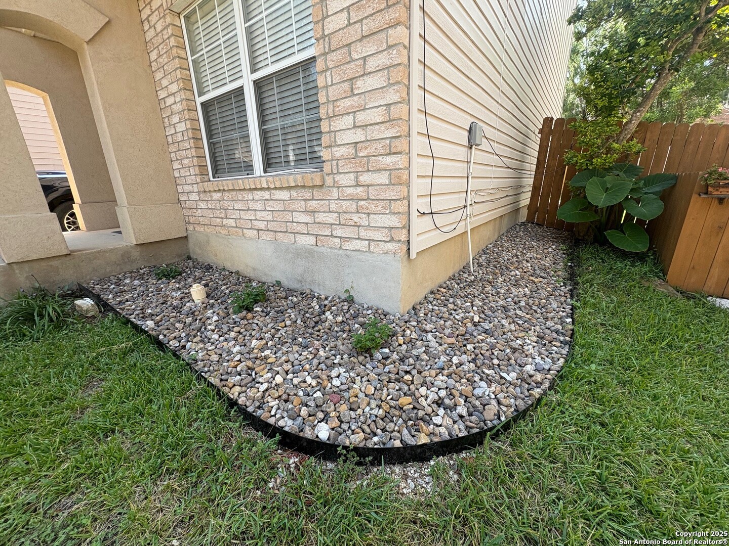 10134 Ranger Canyon San Antonio, TX 78251 - Photo 2 of 22 a view of a backyard with plants
