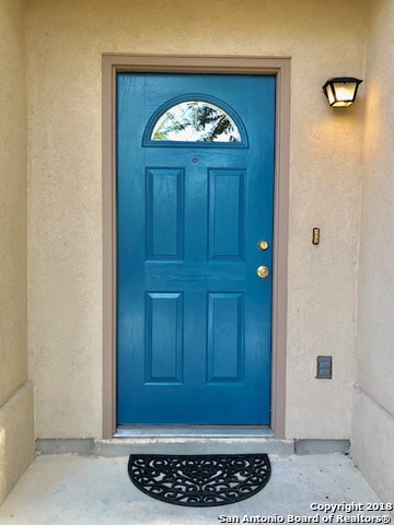 10134 Ranger Canyon San Antonio, TX 78251 - Photo 3 of 22 a view of a entryway door with wooden floor