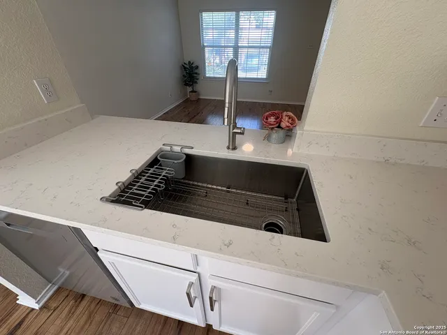 a close view of a stove a microwave and cabinets in the kitchen